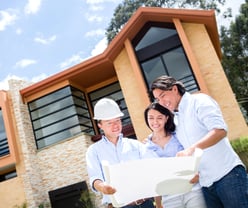 Loving couple talking to the architect about a house